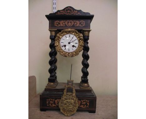 A 19th century continental portico clock with marquetry inlaid case and 8-day striking movement