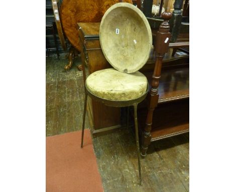 A circular oak work or cheese table raised on an ironwork tripod support, together with a pine dairy bowl