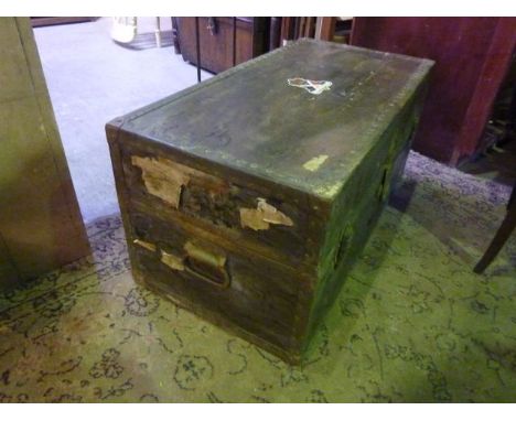 A vintage trunk with canvas and steel banded borders