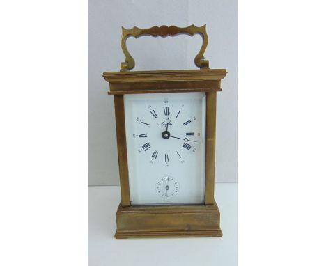 A simple brass carriage clock with 8-day movement and alarm (lacks bell)