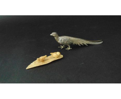 An ivory group - cock and hen on a large feather and a plated exotic pheasant table piece