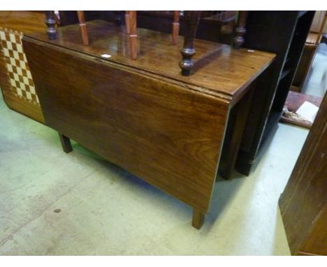 A Georgian mahogany drop leaf dining table raised on four square moulded supports, 108 cm long