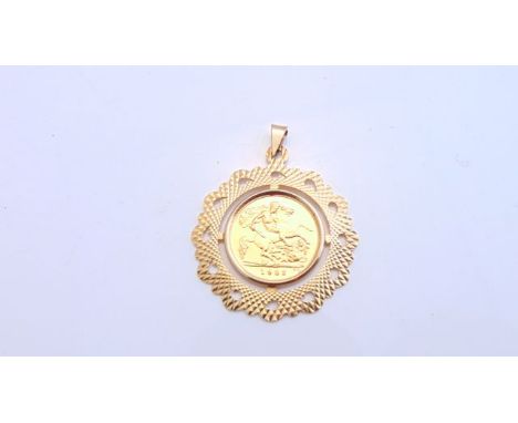 A half sovereign pendant, 1982, the 9ct gold border with engine-turned decoration, 7g