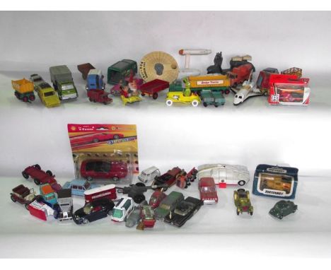 A box containing an assortment of vintage die cast model vehicles, etc, to include a Corgi Kermit the Frog, Dinky USS Enterpr