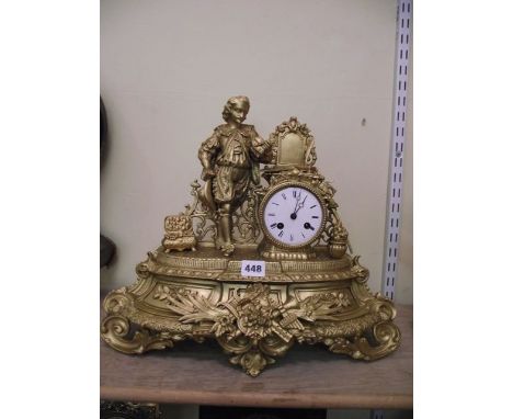 A 19th century spelter mantel clock, the 8-day striking movement set within a classical case showing  an Elizabethan scolar
