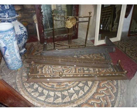 Three various 19th century brass fenders and a further brass framed firescreen