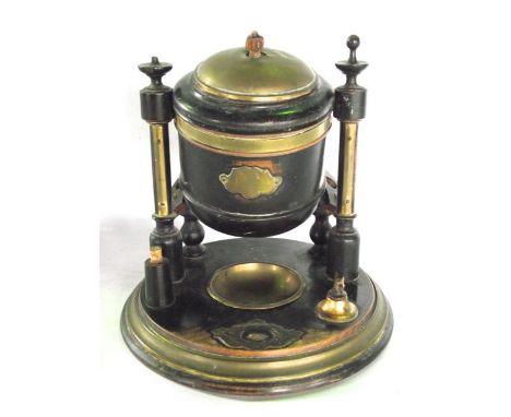 A Victorian desk top tobacco compendium, the central timber caddy with brass banding raised and pivoting on flanking column s