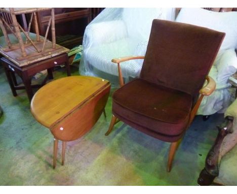 An Ercol beechwood armchair with brown dralon upholstery plus matching drop leaf side table