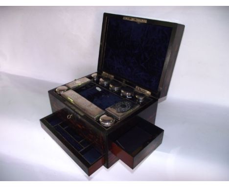 A good quality late 19th century coromandel veneered travelling vanity case with vacant metallic cartouche and lock escutcheo