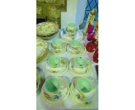 A six place Queen Anne Louise pattern tea service comprising milk jug, sugar bowl, cake plate, further serving plate, six cup