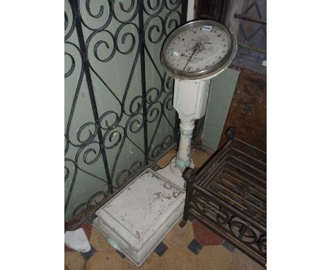 An Edwardian cast iron set of bathroom scales with raised column and display by Salter's, "The Compact Weighing Machine" numb