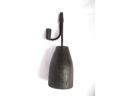 An iron work nip/rush light, raised on a turned oak base in the 18th century manner