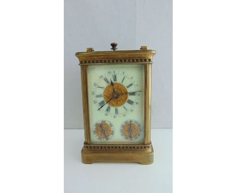 A carriage clock with 8-day movement, subsidiary day and month dials