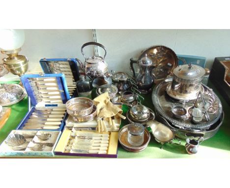 A large quantity of silver plated wares to include a tray of oval form with pierced gallery sides, a further tray of oval for