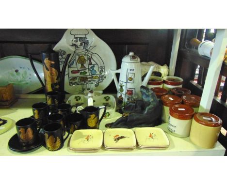 A six place Portmeirion black ground coffee service in the Phoenix pattern comprising coffee pot, milk jug, sugar bowl, six c