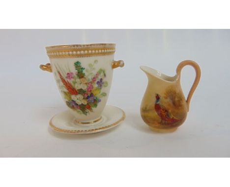 A Royal Worcester ivory ground two handled vase with integral stand, with painted violet and other floral decoration beneath 