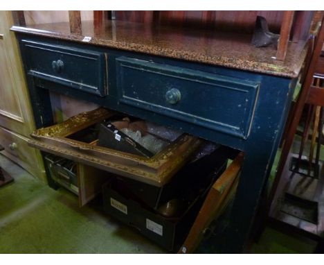 A painted kitchen/work table, the base fitted with two drawers with open shelving below and set beneath a polished granite to