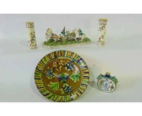 A continental model of an 18th century style horse drawn carriage with lady passenger, raised on a floral encrusted oval base