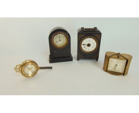 A small 19th century table clock in an ebonised case with applied brass mounts, a small mantel clock in black slate casework,