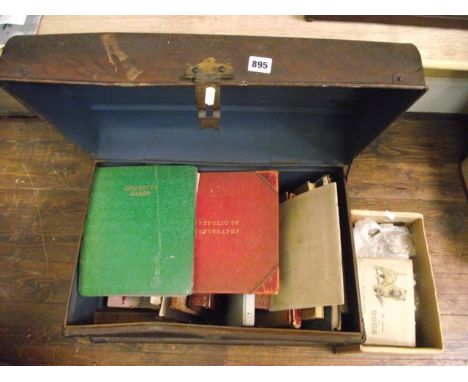 A tin trunk containing a quantity of miscellaneous books including a number of James Bond paperbacks, The Victoria Jubilee Fo