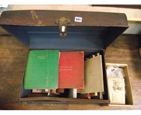 A tin trunk containing a quantity of miscellaneous books including a number of James Bond paperbacks, The Victoria Jubilee Fo