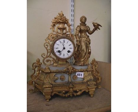 A 19th century gilded spelter mantel clock with additional onyx panels, the 8-day striking movement surmounted by an Elizabet