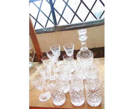 A set of 6 Waterford crystal drinking glasses together with a good quality mallet shaped decanter with faceted neck and malle