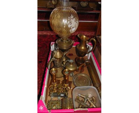 A brass oil lamp with spherical shade with floral detail and clear glass chimney, further brass wares to include eastern kett