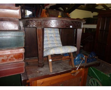 An Edwardian mahogany D end side table raised on two square taper legs with spade feet and a small bedroom chair