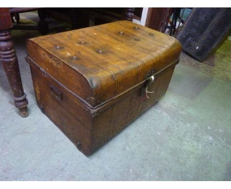 A vintage tin trunk with original simulated timber paintwork
