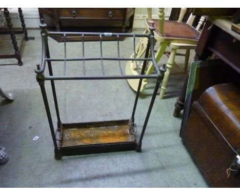 A Victorian brass and iron stick stand with twelve divisions complete with drip tray, 50 cm wide