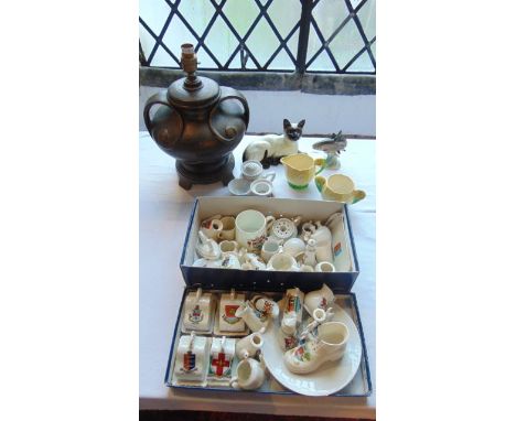 A collection of ceramics including a Beswick recumbant Siamese cat with impressed number 1559, a Goebel Model of a fish, a qu