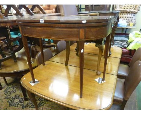 A Georgian mahogany D-end fold over top card table raised on four square tapered legs, with string inlaid detail