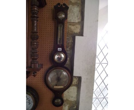 A 19th century mahogany wheel barometer with silvered dials