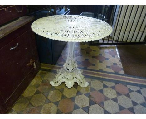 A Victorian cast iron occasional table the circular top with pierced detail raised on a vase shaped stem and foliate base, wi