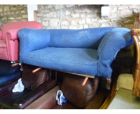 An Edwardian cottage Chesterfield sofa with drop end on shaped supports