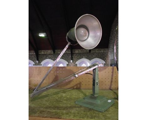 A vintage anglepoise lamp with green coloured base stamped The Anglepoise, etc