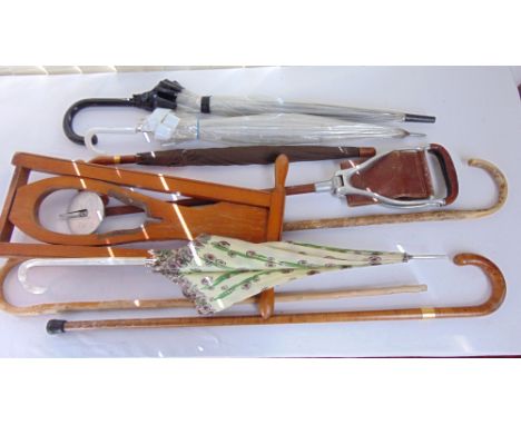 A vintage timber boot Pull, various walking canes, umbrellas, a shooting stick, etc