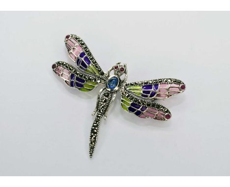 A silver 'plique-a-jour' dragonfly brooch/pendant, set with cabochon sapphire, faceted ruby eyes and wing tips and marcasite 