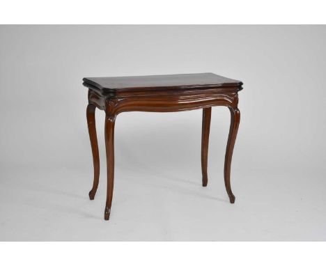 A late Victorian mahogany serpentine fold-over pull-out card table, the moulded serpentine top inset with a baize skiver, abo