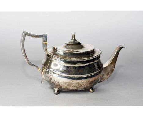 A George III silver teapot, Thomas Wallis (II) &amp; Jonathan Hayne, London 1812, of oval form with gadrooned rim and raised 