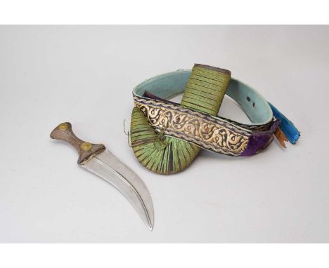An Islamic Yemen Jambiya knife, with typical 8" double-edged curved blade and horn handle, the leather scabbard applied with 