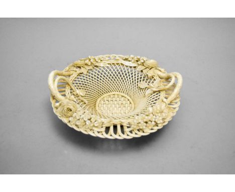 A Belleek First Period two-strand basketcirca 1863-1881of circular form with twin simulated branch handles and applied flower