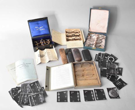 A collection of opthalmic accessories and spectacles, first half 20th century, including cased sets of sample spectacles, pre