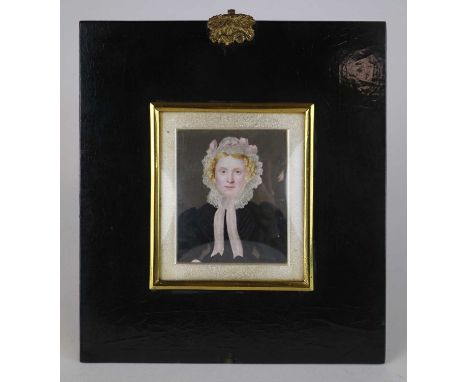 British School (early 19th Century) A portrait miniature of a blonde female sitter wearing a lace bonnet with pink ribbons an