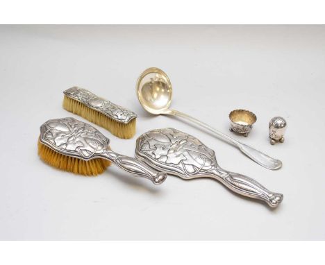 An Edwardian three piece silver mounted dressing table set, Birmingham 1901, together with a silver pepper pot, a silver salt