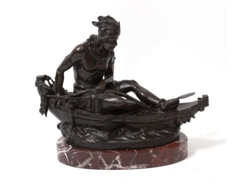 A BRONZE FIGURE OF A NATIVE AMERICAN INDIAN seated in a canoe and with bow and spear, impressed 'Duchoiselle' on an oval marb