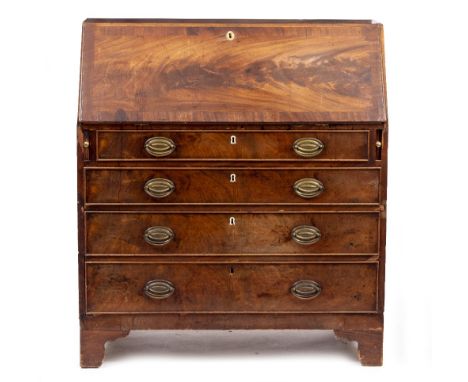 A GEORGE III MAHOGANY BUREAU the fall front opening to reveal satinwood lined drawers and pigeonholes, above four long gradua