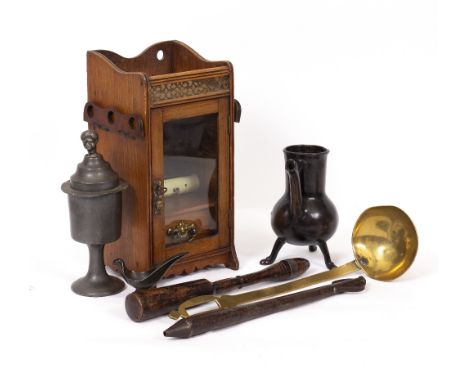 A LATE VICTORIAN PIPE AND TOBACCO BOX, a small pewter pipe stand in the form of a bird, a lead tobacco jar, a brass ladle, a 
