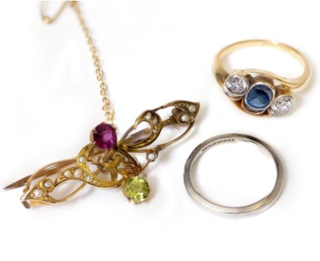 A VICTORIAN PERIDOT, GARNET AND SEED PEARL BAR BACKED BROOCH, a platinum band and a sapphire and diamond three stone ring on 